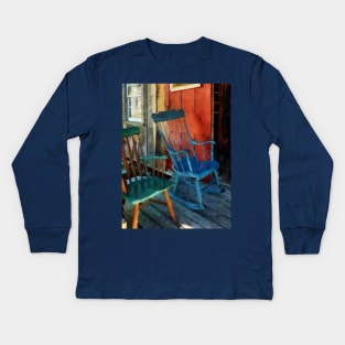 Blue and Green Rocking Chairs Against Red Door Kids Long Sleeve T-Shirt